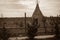 Teepee aka wigwam in the field with young trees. Vintage sepia toned image