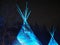 Teepee With Blue Light Against A Dark Sky