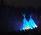 Teepee With Blue Light Against A Dark Sky