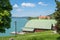 Tegernsee lakeside with boathouse and view to famous castle, upper bavaria