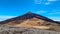 Teide - Hiking trail over volcanic desert terrain leading to summit of volcano Pico del Teide, Tenerife, Spain.