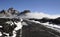 Teide National Park or Las Canadas del Teide in winter, views towards the road covered in snow and low white clouds passing by