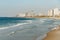 Tel Aviv coastline view. Modern city, sea and a beach.