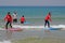 Tel-Aviv, Israel - 04/05/2017: The girls are racing along the wave in the Mediterranean. School surfing for children