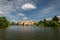 Telc cityscape in Czech republic, in the background Church of the Name of Jesus, in the foreground pond Ulicky