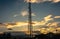 Telecommunication cellular tower in sunset sky