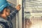 Telecommunication Technician Looking Inside Servers Rack