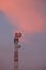 Telecommunication tower antenna at sunset