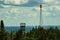 Telecommunication tower in the blue and cloudy sky in Quebec, Canada