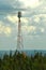 Telecommunication tower in the blue and cloudy sky in Quebec, Canada