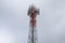 Telecommunication tower red and white antenna radio telephone mobile on sky background