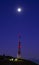 Telecommunications antenna with full moon on Mount Jaizkibel