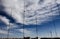 Telecommunications antennas on a cloudy blue sky