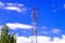 Telecommunications cell mobile tower 5G against a blue sky.