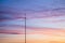 Telecommunications masts of television antennas against a sunset