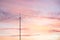 Telecommunications masts of television antennas against a sunset