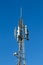 Telecoms tower on a brigt blue sky