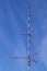Telecomunication television, radio antenna, satellite tower on blue sky background