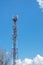 Telecomunication tower antenna over blue sky