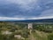 Telegraph tower of Chappe in the natural landscape of the Alpilles overlooking the green valley of the Durance under a cloudy sky