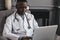 Telehealth with virtual doctor appointment and online therapy session. Black doctor online conference