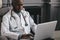 Telehealth with virtual doctor appointment and online therapy session. Black doctor online conference