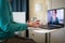 telemedicine concept elderly woman speaking to her doctor online and taking her blood pressure