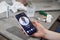 Telemedicine, technology and healthcare concept. Top angle close-up view of table with pills, thermometer, water and