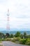 Telephone base station on the high mountain with white clouds. I