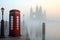 telephone booth on a foggy london morning with tower bridge behind