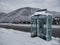 Telephone booth on a snow-covered mountain road