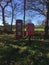 Telephone box and postage box in the countryside.