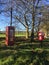 Telephone box and postage box in the countryside.