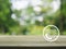 Telephone and mail icon button on wooden table over blur tree