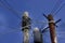 Telephone pole with wires against cloudy sky with rectangular co