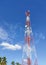 Telephone signal pole transmission tower below has coconut trees, Sky background