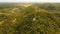 Telephone signal tower among green forest and mountains. Aerial view. Siargao island Philippines.