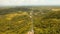 Telephone signal tower among green forest and mountains. Aerial view. Siargao island Philippines.