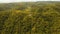 Telephone signal tower among green forest and mountains. Aerial view. Siargao island Philippines.