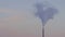 A telephoto shot isolating a coal power plant chimney and emissions against a pink dusk sky 4 k uhd timelapse