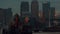 Telephoto shot showing the Canary Wharf financial center in London, Emirates Airline and Thames Barrier during early evening