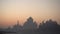 A telephoto shot of Taj mahal in the morning. Shot of Taj Mahal in the morning sunrise with orange sky, forming silhouette