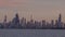 A Telephoto Timelapse of the Chicago Skyline over Lake Michigan at Sunset
