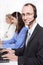 Telesales or helpdesk team - helpful man with headset smiling at