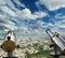 Telescope viewer and city skyline at daytime (against the background of very beautiful clouds). Paris, France