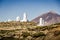 Telescopes of Tenerife. SLOOH observatory in las canadas national park. Telescope domes with El Teide volcano in the background.