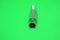 Television antenna connector on a green background