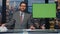 Television presenter point green screen talk evening news. Man ending newscast