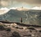 Television relay tower station on Costila Peak in Bucegi mountains Romania. Black and white landscape with clouds over the