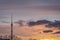 Television tower Ostankino in Moscow against sunset cloudy sky in background. TV tower